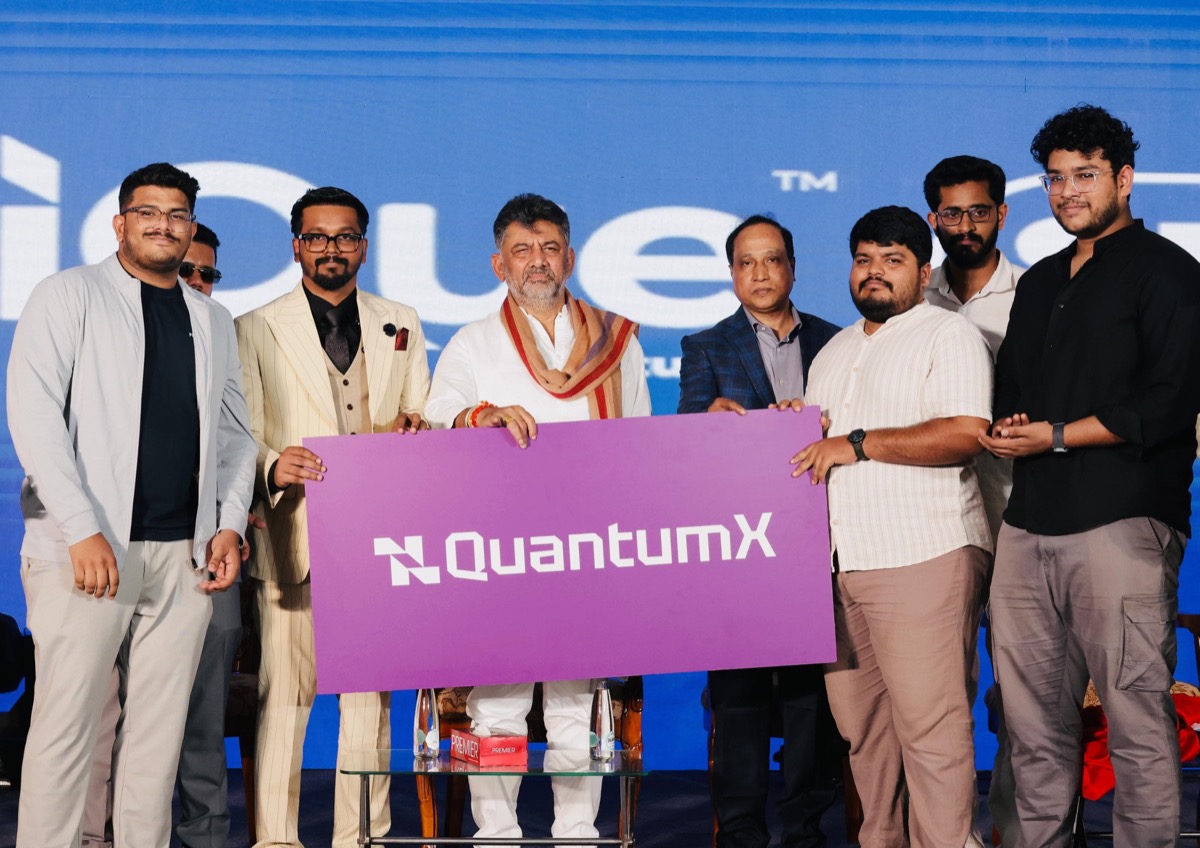 QuantumX launch – Ajmal and team with QuantumX banner